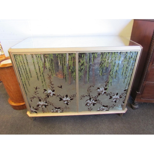 1021 - A mirrored and silvered mini bar unit with floral design to front, two cupboard doors revealing thre... 