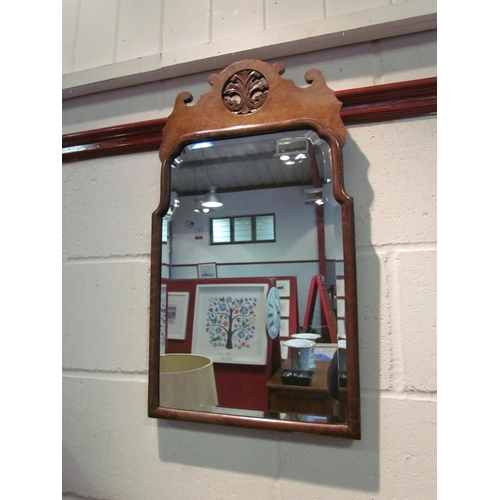 1033 - A Regency style walnut fretwork wall mirror, bevelled glass, 63cm x 36cm