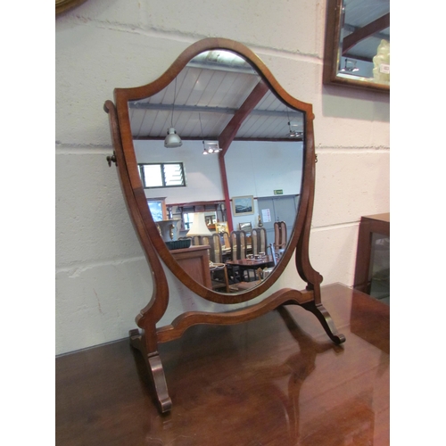 1034 - A shield shaped table top mirror, 62cm tall x 43cm wide