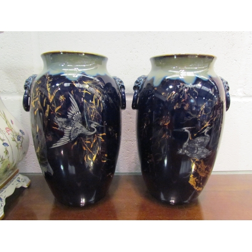 1040 - A pair of blue glazed vases with gilt crane and willow pattern together with a Franklin Mint decorat... 