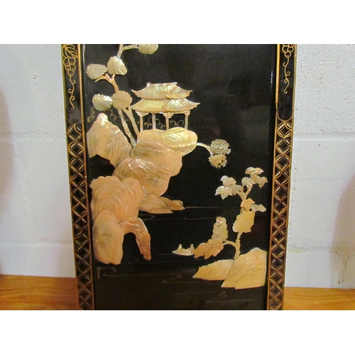 1043 - A Japanese lacquered panel with high relief mother-of-pearl detail, 91.5cm x 31cm              (E) £... 