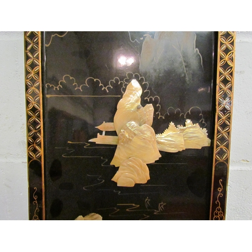 1043 - A Japanese lacquered panel with high relief mother-of-pearl detail, 91.5cm x 31cm              (E) £... 