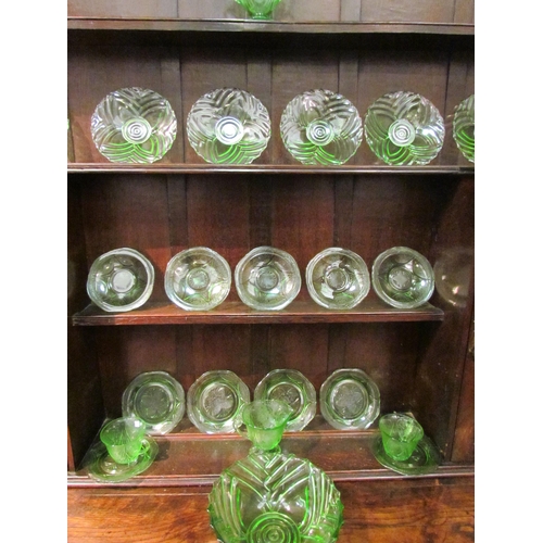 1047 - A moulded green glass Art Deco fruit/dessert set comprising of bowl and plates together with a simil... 