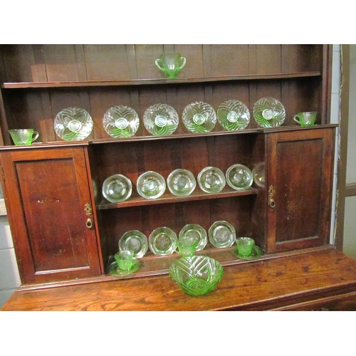 1047 - A moulded green glass Art Deco fruit/dessert set comprising of bowl and plates together with a simil... 