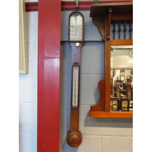 1076 - A Negretti & Zambra mahogany stick barometer