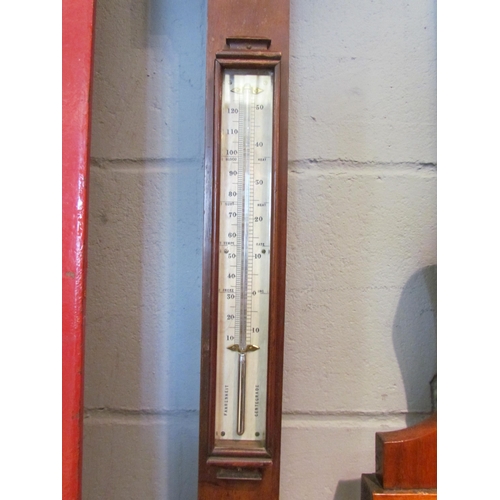 1076 - A Negretti & Zambra mahogany stick barometer