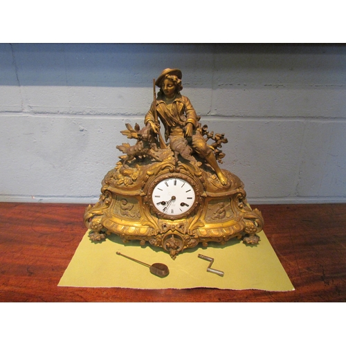 1077 - A gilt metal mantel clock. Henry Marc Paris dial. Decorated with huntsman, hound and pheasant. 35cm ... 