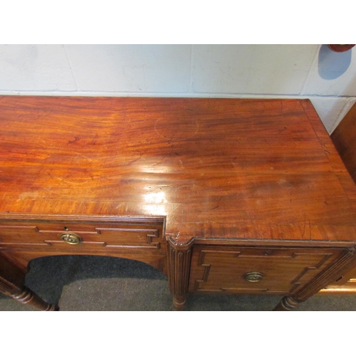 1079 - A Regency sideboard, single drawer flanked by drop-flap cupboard doors, turned legs, handle loose, 9... 