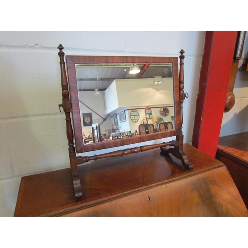 1082 - A Victorian mahogany swivel mirror, turned supports, 43cm tall x 44cm wide