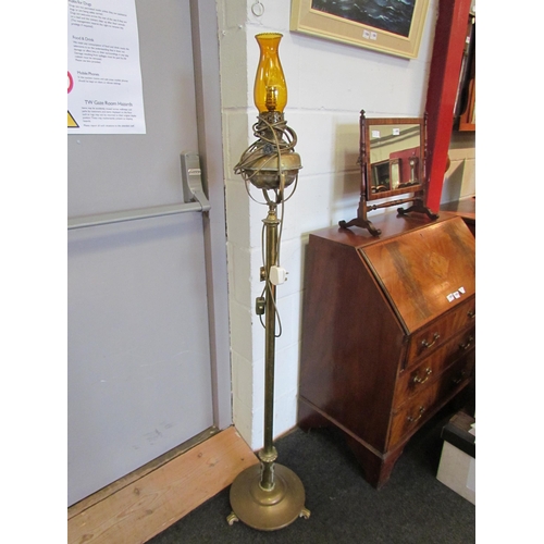 1084 - WITHDRAWN - An early 20th Century brass standard lamp converted to electric, amber glass chimney, 15... 