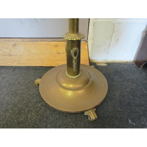 1084 - WITHDRAWN - An early 20th Century brass standard lamp converted to electric, amber glass chimney, 15... 