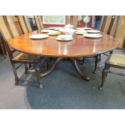 1086 - An oak extending dining table with two extra leaves, vase form column on four legs, 75cm tall x 228c... 