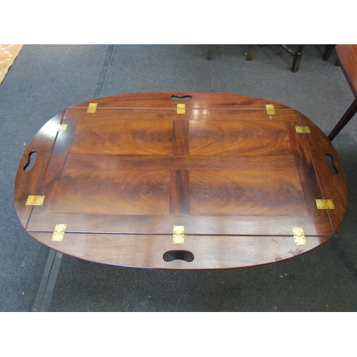 1089 - A reproduction mahogany butler's tray-top coffee table, 45cm tall x 130cm long x 84cm wide