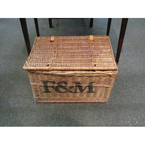 1092 - A wicker hamper stencilled F & M, 56cm wide, 38cm deep, 37cm high