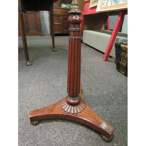 1095 - A William IV mahogany pole screen, the brass pole with needlepoint floral design, on a melon fluted ... 