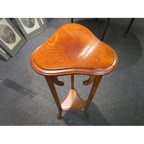 1096 - A mahogany slender jardinière stand with under-tier, 93cm tall