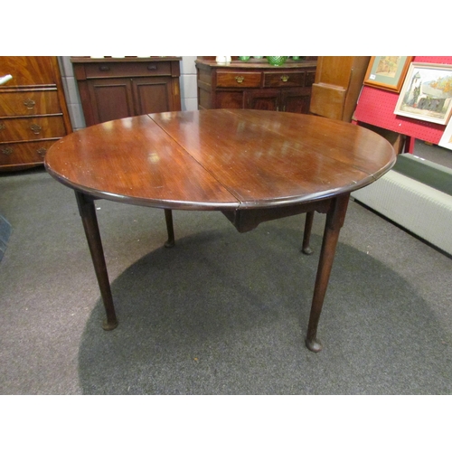 1098 - A Georgian mahogany drop-leaf circular top dining table,  71cm tall x 122cm long x 110cm wide