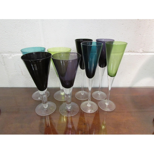 1124 - Two sets of four coloured glass wine glasses (8)             (R) £15