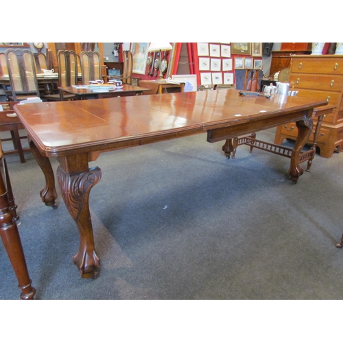 1126 - A circa 1900 oak extending dining table with round cornered top, on carved cabriole legs to ball and... 