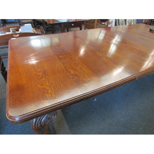 1126 - A circa 1900 oak extending dining table with round cornered top, on carved cabriole legs to ball and... 