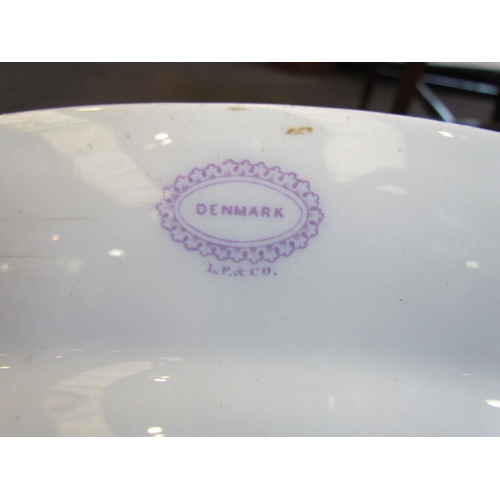 1128 - A set of three oval meat plates, white ground with purple floral design, possibly Livesley, Powell &... 