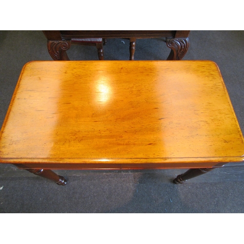 1129 - A Victorian mahogany side table with two concealed frieze drawers, raised on turned legs, 73cm tall ... 