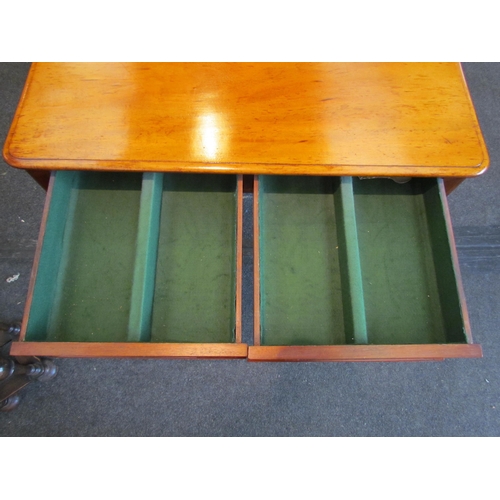 1129 - A Victorian mahogany side table with two concealed frieze drawers, raised on turned legs, 73cm tall ... 