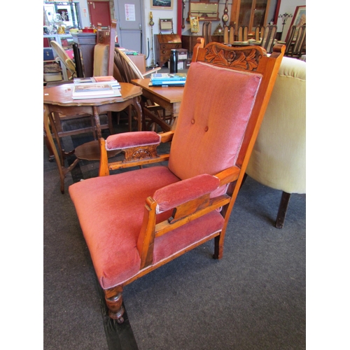 1141 - A Victorian velour armchair with pink upholstery