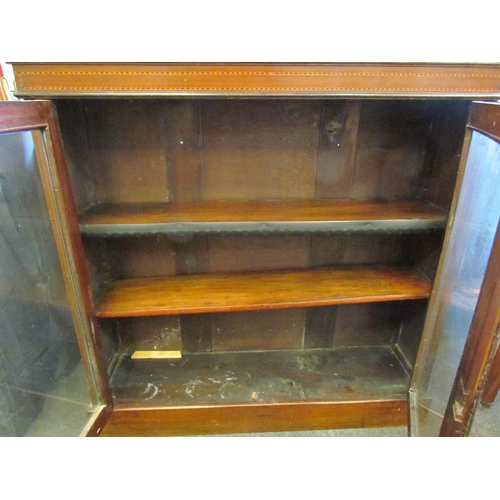 1145 - An Edwardian mahogany glazed front bookcase, satinwood stringing, on plinth base, 104cm tall x 105cm... 