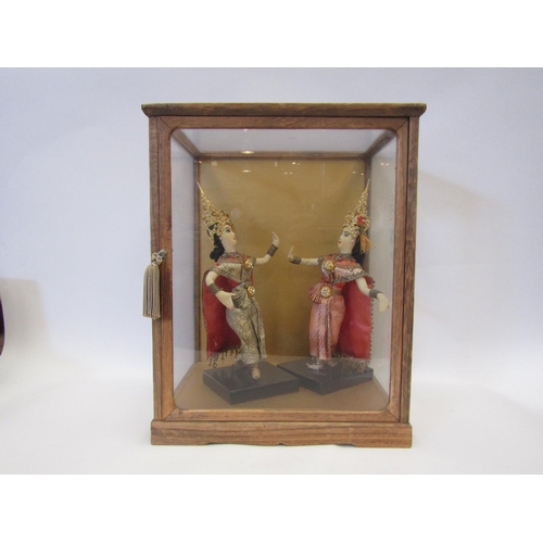 1001 - A pair of Thai fabric female figures in display case, 34cm tall x 26cm wide x 23cm deep