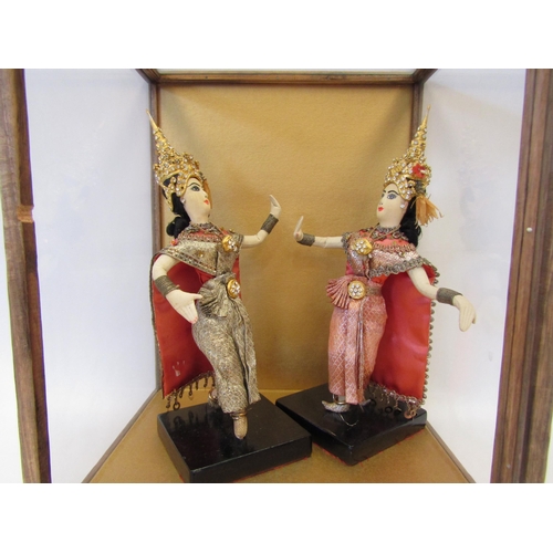 1001 - A pair of Thai fabric female figures in display case, 34cm tall x 26cm wide x 23cm deep