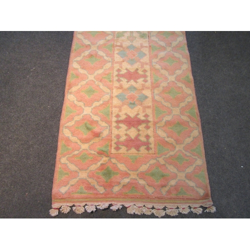 1131 - Two wool rugs with matched patterns, cream and peach ground, approximately 298cm x 80cm