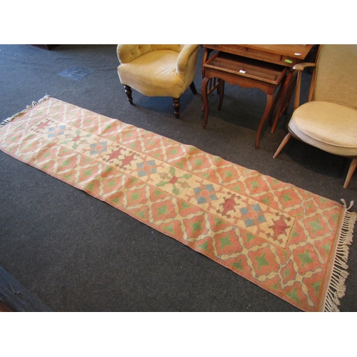 1131 - Two wool rugs with matched patterns, cream and peach ground, approximately 298cm x 80cm