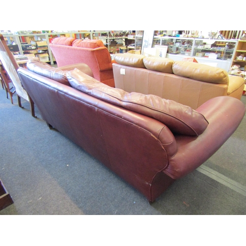 1147 - A Laura Ashley large two seater leather sofa with scrolled arms on castors             (E) £10-15