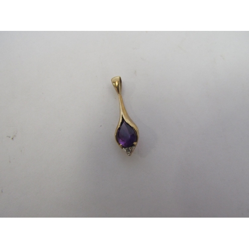 1274 - A 9ct gold blue stone ring and a 9ct amethyst and diamond pendant