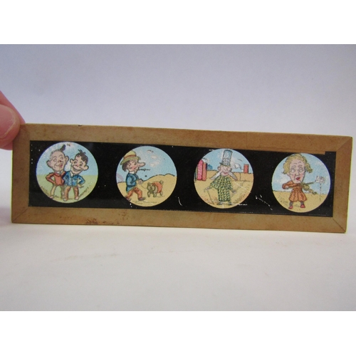 1288 - A box of eight Alice in Wonderland magic lantern slides together with seaside cartoon slides