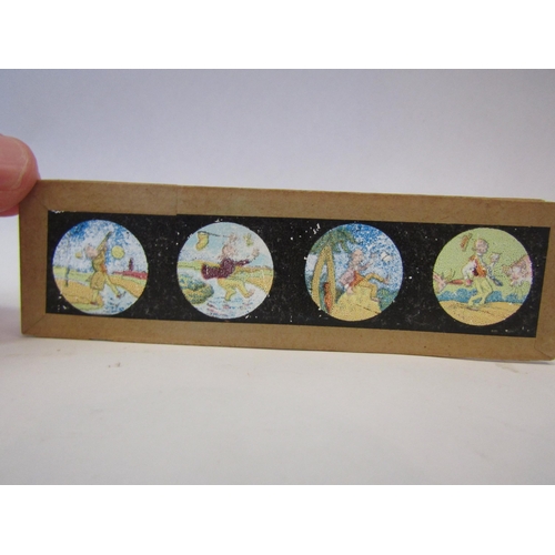 1288 - A box of eight Alice in Wonderland magic lantern slides together with seaside cartoon slides