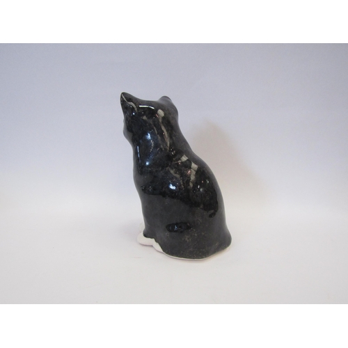 1300 - A Winstanley figure of a black and white seated cat, 18cm tall