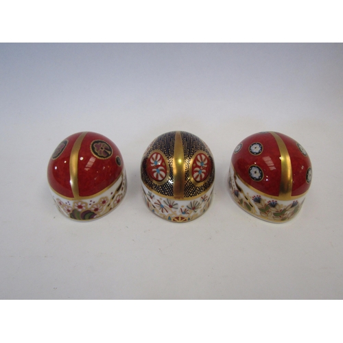 1312 - Three Royal Crown Derby paperweights of Ladybirds, silver stoppers