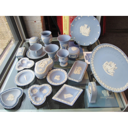 1194 - A good quantity of Wedgwood Jasper ware including plates, clock, various vases etc., several with or... 