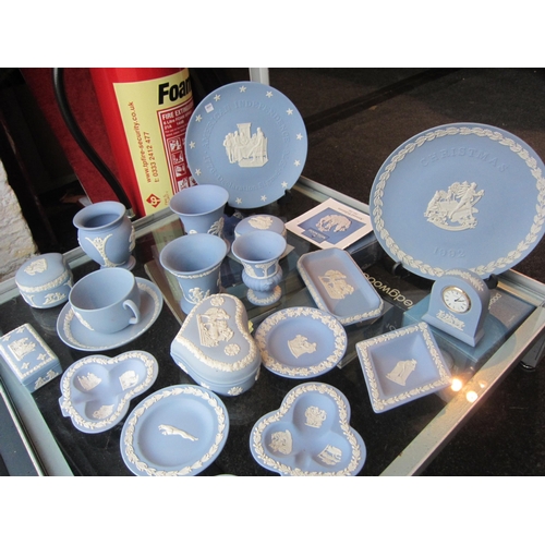 1194 - A good quantity of Wedgwood Jasper ware including plates, clock, various vases etc., several with or... 