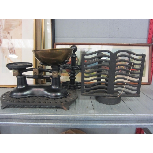 1224 - A collection of cast iron kitchenalia to include Victor scales with brass pan, trivet, egg stand, bo... 