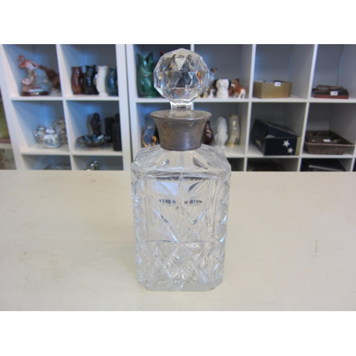 1348 - A silver collared crystal whiskey decanter