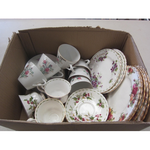 1362 - A box of china teawares including Royal Albert Christmas Rose, Old Country Roses, violets and German... 