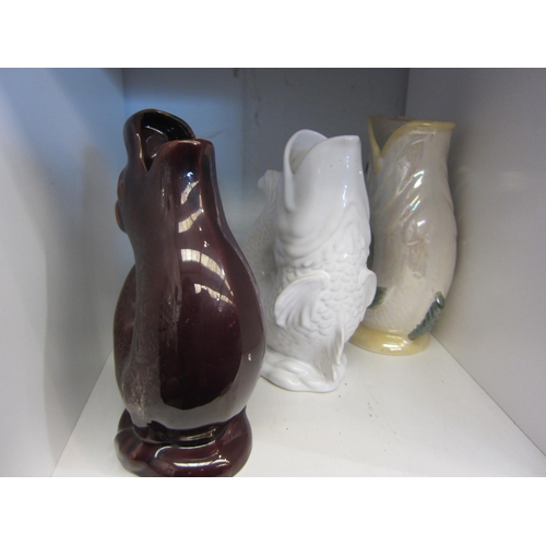 1392 - A Kernewek pottery gluggle jug and two unnamed examples, tallest 24cm