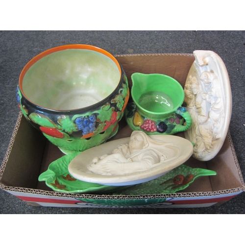 1394 - A box containing decorative ceramics including Beswick and Carlton ware leaf dishes and jug. Two hig... 