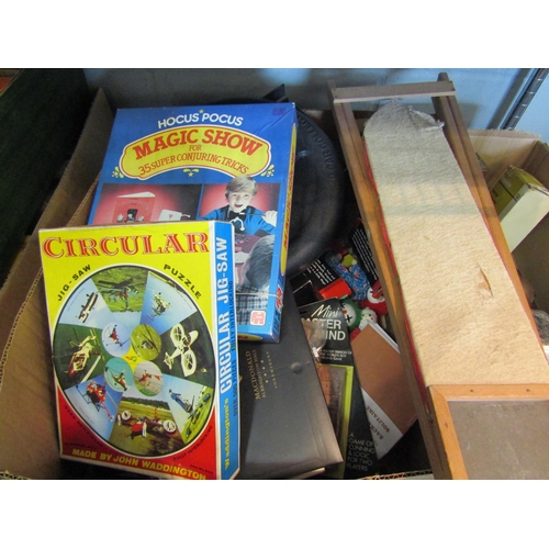 1425 - A box of mostly vintage games including jigsaws, child's ironing, magic show etc