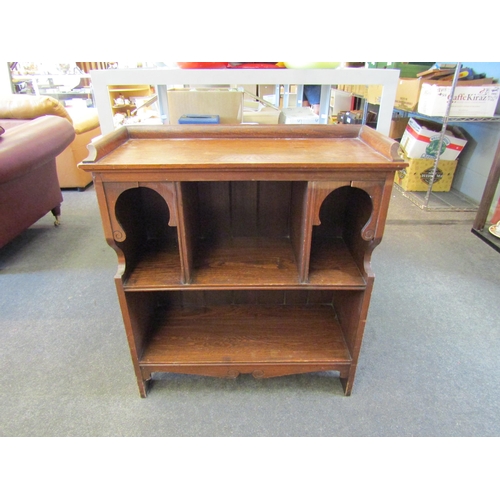 1466 - A 20th Century oak hall bookcase, with twin arched sections, 77cm wide, 33cm deep, 85cm high