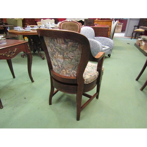 4002 - A Circa 1900 oak desk armchair with cushion on square tapering fore legs and 'H' stretcher