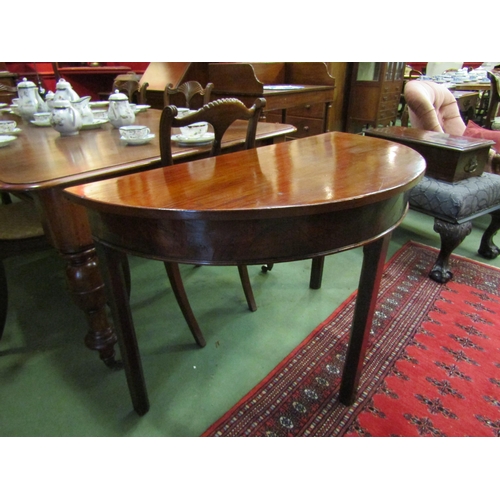 4006 - A George III mahogany demi-lune table on chamfered square leg supports, 72cm tall x 108cm wide x 53c... 